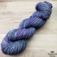 Variegated yarn in deep sea blue and complementary purple.
