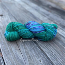 Variegated bright aqua and true green with purple speckles through the aqua.