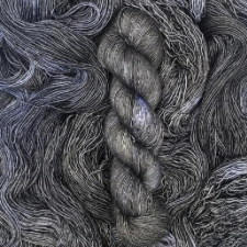 Deep gray tonal yarn with hints of periwinkle.