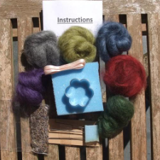 Slivers of top in 6 colors, along with needle felting tools and instructions.
