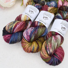 Deep golds, reds and blues combine in this variegated skein.