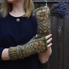 Fingerless mittens featuring distinctive Northern colour knitting techniques like corrugated rib and Latvian braid along with the stranded colourwork and afterthought thumb.