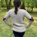Pullover with garter stitch hearts over the elbows