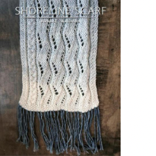 Scarf uses waving lace patterns to shift the smooth edge that lies beside a simple cable.