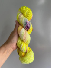 Neon yellow skein with splashes of purple and blue.