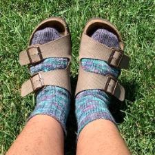 Socks in a plain and textured version, shown with Birkenstocks sandals.