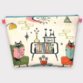Very large zippered bag has print of 1950s living room with cats reading books.