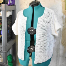 Crocheted mesh short-sleeve cardigan.