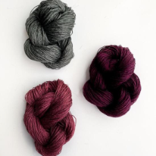Fingering weight linen in solid colors, shown as squishy deconstructed skeins.