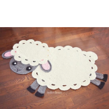 Crocheted rug in the shape of a frolicking lamb.