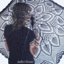 Black sun umbrella crocheted in pineapple lace.