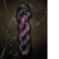 Deep black and purple yarn with pops of orchid purple.