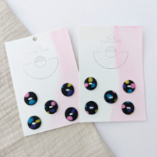 Black buttons with pops of pastel colors.