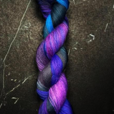 Variegated yarn in deep, cool purples, electric blues and hot pink.