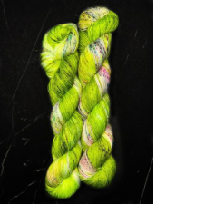 Variegated yarn in bright kiwi, cream and raspberry.