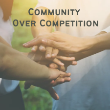 People stacking hands as a show of unity, with the headline Community Over Competition.
