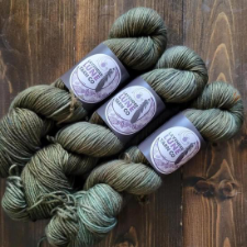 Tonal olive green yarn with several subtle shades woven through.