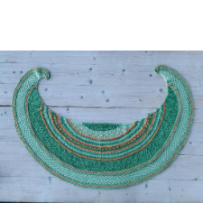Crescent shawl with arcs of different colors and textures.