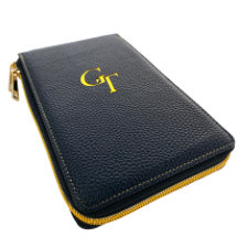 Zippered case in pebbled leather with gold letters GT on top.