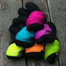 Deepest black skeins with a pop of pure neon color. Each skein has a different neon color pop.