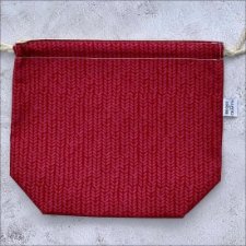 Flat bottom 11 inch by 9 inch drawstring project bag. Fabric looks like a red stockinette fabric.