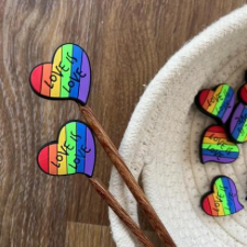 Rainbow Pride heart needle stops that say Love is Love