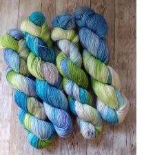 Variegated yarn in light blues, greens and yellows.
