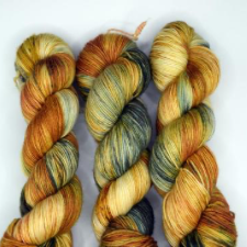 Variegated yarn in warm tans and greens.