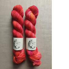 Golden Girls theme yarn in tonal deep coral.