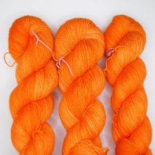 Saturated orange tonal yarn.