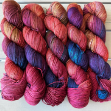 Bright, variegated yarn in cool pinks, blues and purples.