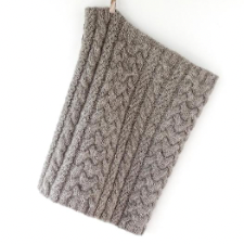 Cables that vary in scale and line provide texture and graphic interest for this cowl, shown in a woolly wool.