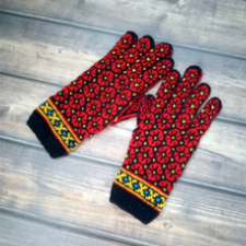 Colorwork gloves with bright flower pattern throughout and geometric colorwork at the cuffs.