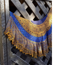Very intricate colorwork shawl in bright blues and yellows.