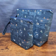 Made to order project bags in two sizes with a print of bottles filled with miniature ocean worlds.