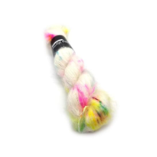 Mohair silk laceweight yarn, mainly white with splashes of bright pink, yellow and green.