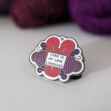 Enamel pin with skeins in a heart shape