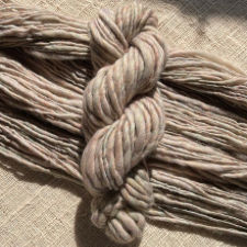 Thick and thin yarn in tonal neutral.