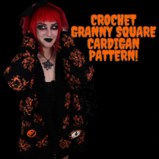 Long cardigan with some granny squares in all black and some in black and orange.