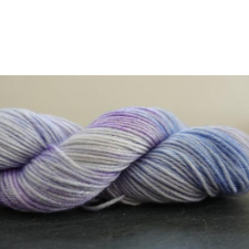 Variegated skein in cream, pale blue and pale violet.