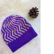 Hat with vertical chevrons in colorwork.