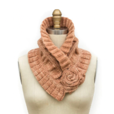 Cross-over cowl has popup top edge and knitted rose that holds the piece together. body of the cowl is wide ribs at top and bottom and ruching in the middle section.
