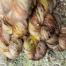 Warm variegated yarn on a variety of bases.