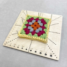 Board that will block squares or hexagons. It also includes a needle gauge.