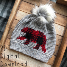 Crocheted beanie with ribbed hem and bear colorwork in lumberjack plaid.