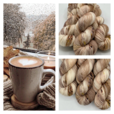 Photo of a rainy day through a window, with a cup of cocoa, snacks and a cocoa-colored candle. Three skeins of cream and milk chocolate yarn.