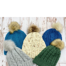 Set of five hat patterns with cable-like textures.