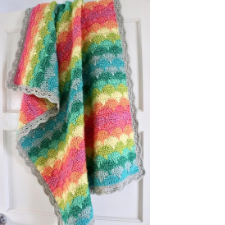 Scalloped baby blanket in half a dozen bright colors, with a new color for each scalloped row.