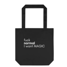 Black tote with white sans serif text reads “Fuck normal. I want magic.”