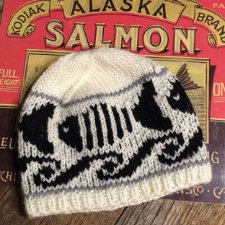 Two-color beanie with wave banner and striped fish.